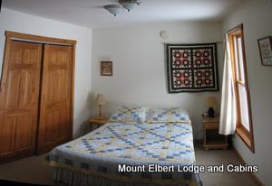 Cinnamon Bear cabin bedroom with a double bed.